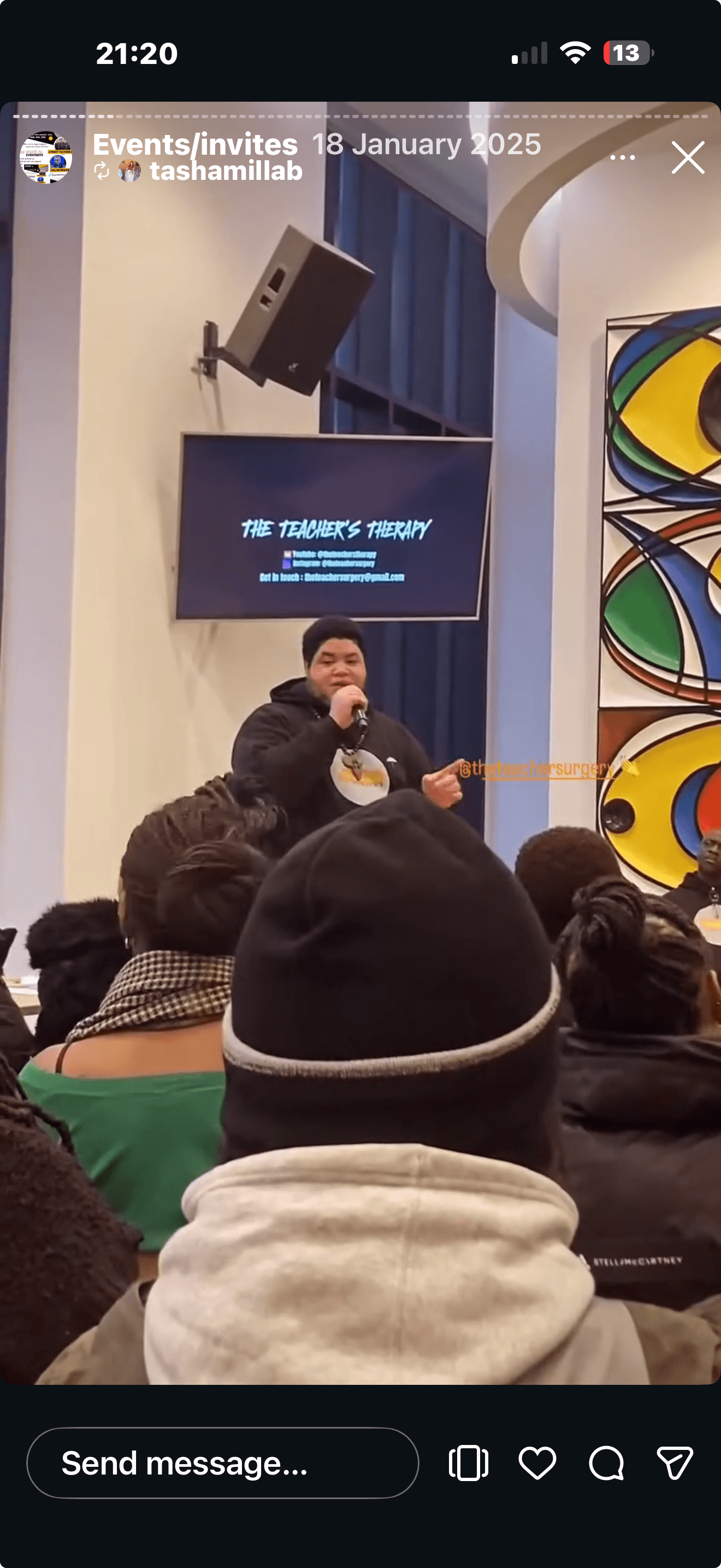A speaker addressing the One For All event audience.